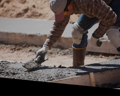 a worker laying concrete 